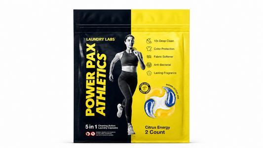 A stand-up pouch of Laundry Labs Power Pax Athletics Citrus Energy 2 Count cleaning active laundry capsules, featuring a black and yellow design with a running woman graphic.